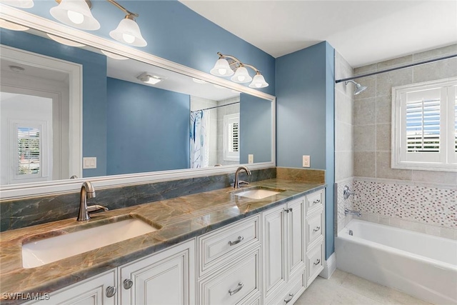 bathroom featuring vanity, tile patterned floors, and shower / bath combo