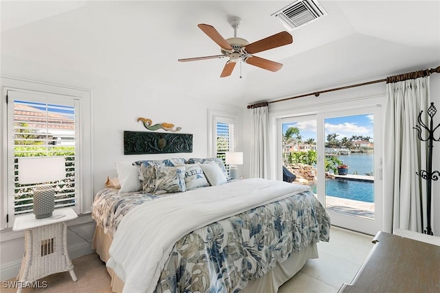 tiled bedroom with vaulted ceiling, a water view, access to outside, and ceiling fan