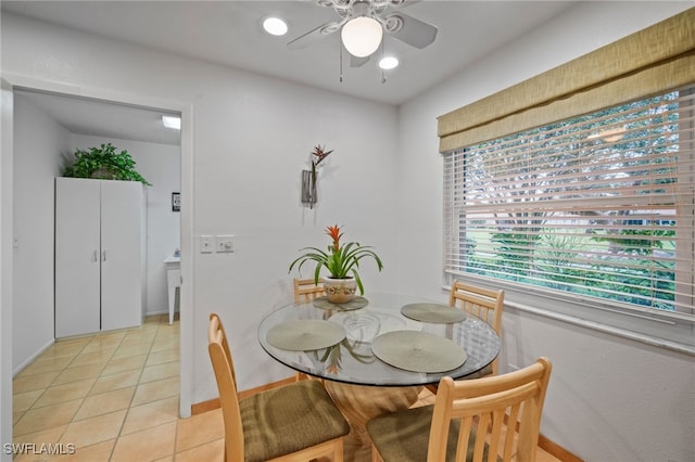 dining area featuring ceiling fan and light tile patterned floors