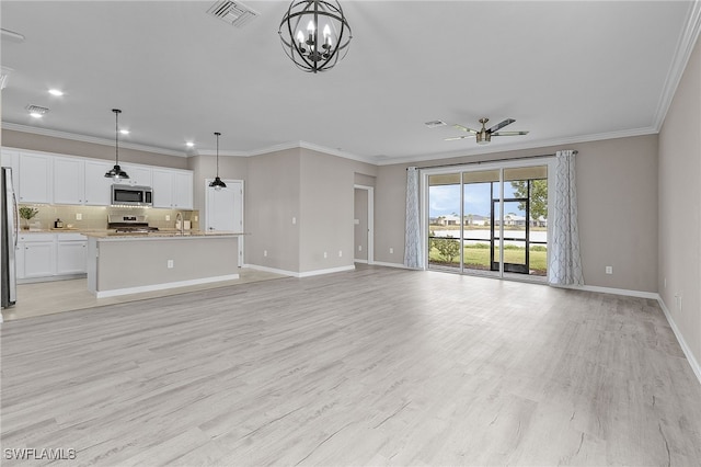 unfurnished living room with ceiling fan with notable chandelier, sink, light hardwood / wood-style flooring, and ornamental molding