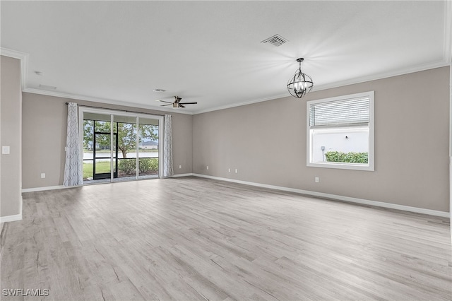 empty room with ceiling fan with notable chandelier, light hardwood / wood-style flooring, and ornamental molding