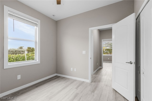 spare room featuring light hardwood / wood-style flooring