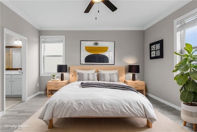 bedroom with light hardwood / wood-style flooring, connected bathroom, ceiling fan, and ornamental molding