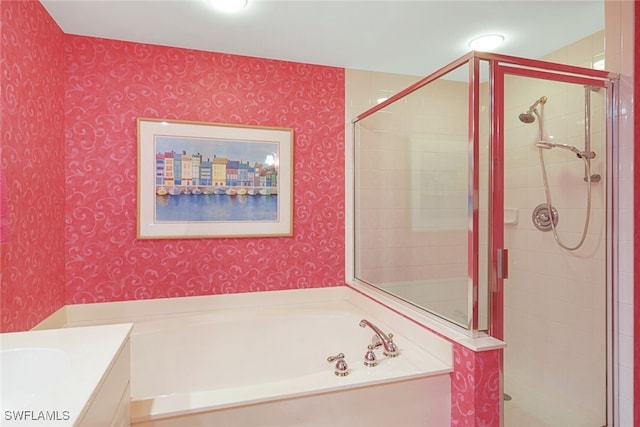 bathroom featuring vanity and separate shower and tub