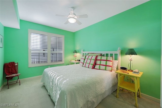 bedroom with light carpet and ceiling fan