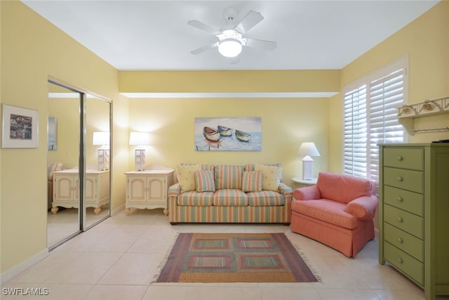 living room featuring light tile patterned flooring and ceiling fan