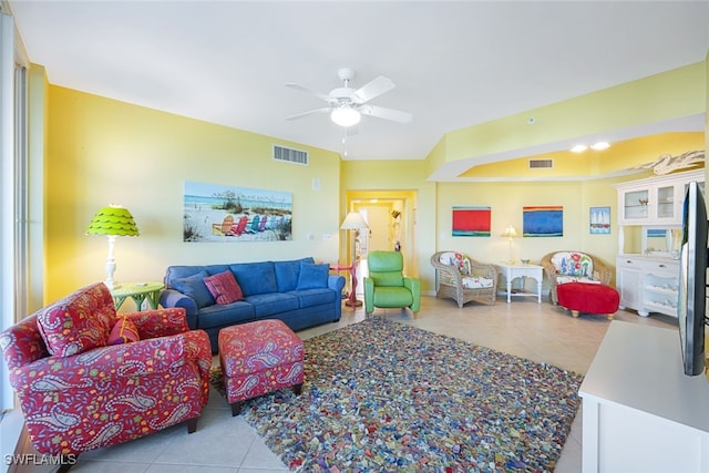 tiled living room with ceiling fan