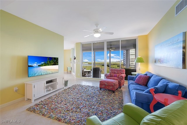 tiled living room featuring ceiling fan