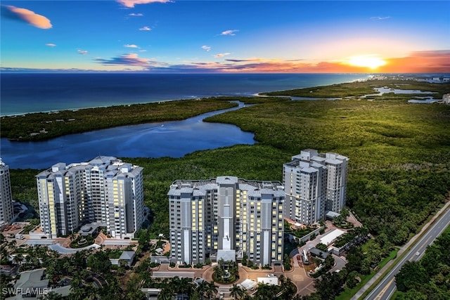 aerial view at dusk with a water view