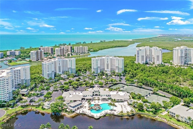 birds eye view of property with a water view