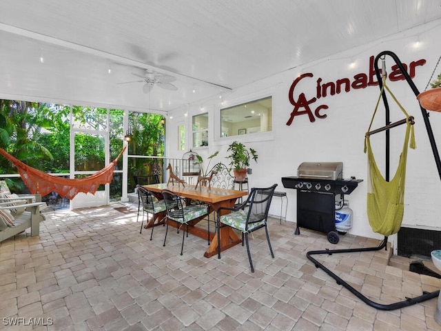 sunroom / solarium with ceiling fan