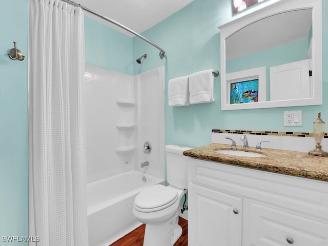 full bathroom featuring shower / tub combo with curtain, wood-type flooring, toilet, and vanity