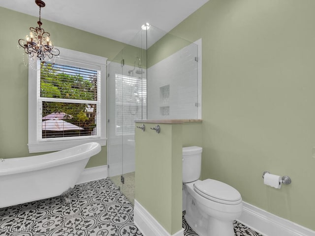 bathroom with an inviting chandelier, tile patterned floors, toilet, and separate shower and tub