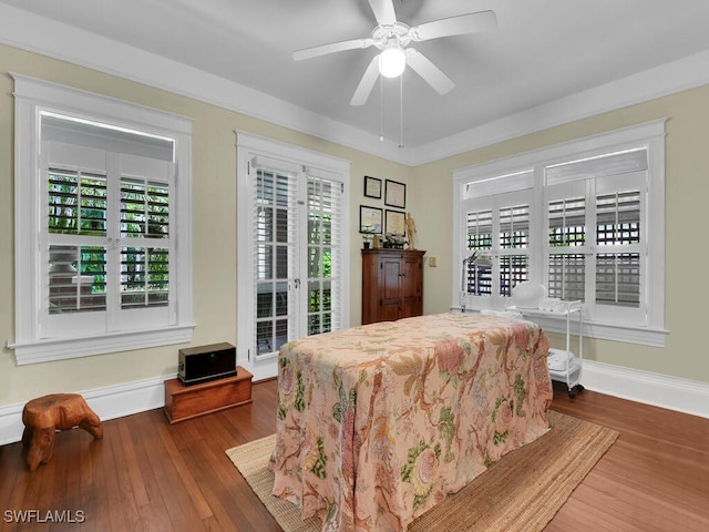 bedroom featuring hardwood / wood-style floors, ceiling fan, and access to exterior