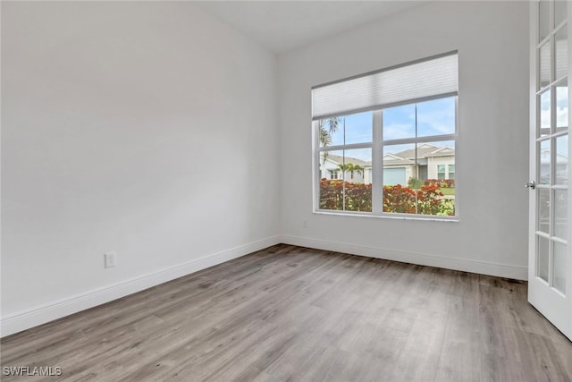 empty room with light hardwood / wood-style floors