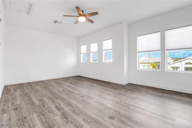 unfurnished room with light hardwood / wood-style floors and ceiling fan