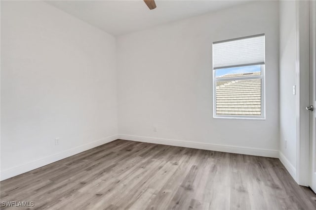 unfurnished room featuring ceiling fan and light wood-type flooring
