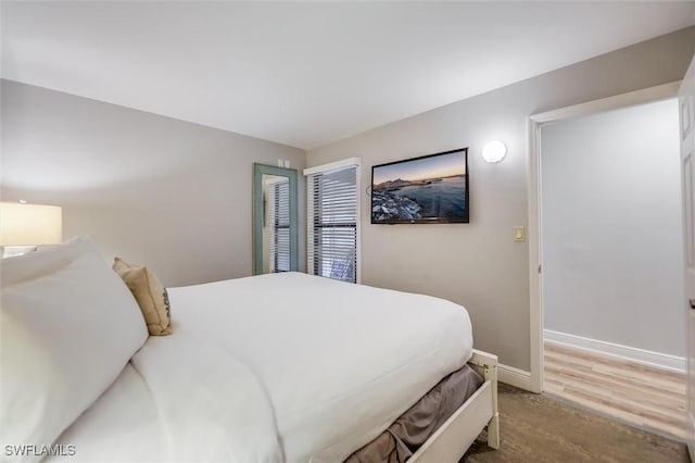 bedroom with light hardwood / wood-style floors