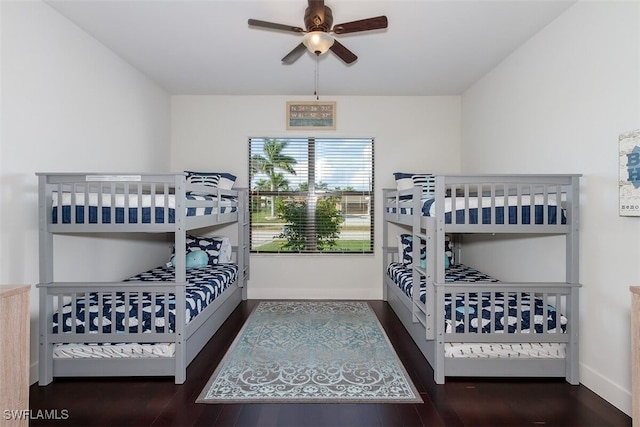 bedroom featuring ceiling fan and dark hardwood / wood-style flooring