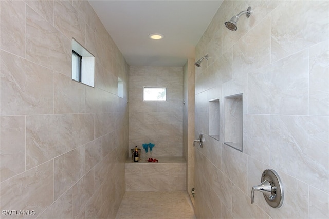 bathroom featuring a tile shower