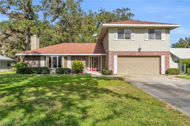 view of front of property with a front lawn and a garage