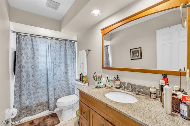 bathroom featuring toilet, vanity, tile patterned flooring, and curtained shower