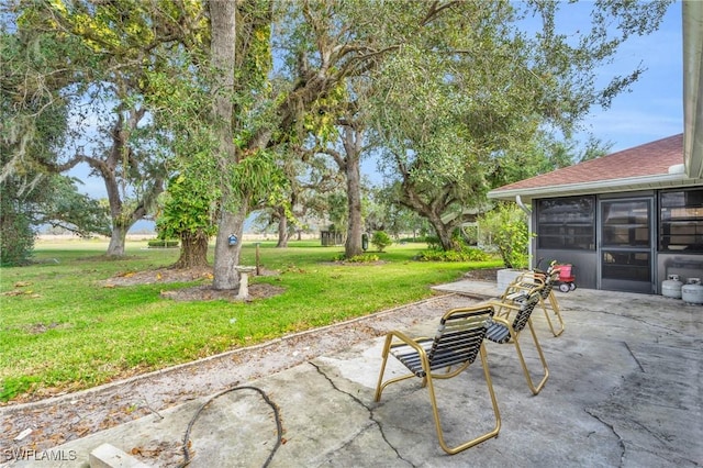 view of patio featuring a sunroom