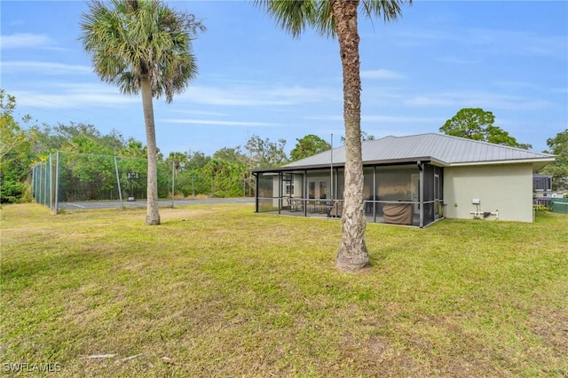 view of yard with a sunroom