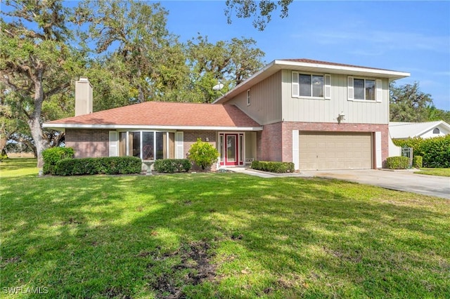 view of front of property featuring a garage and a front yard