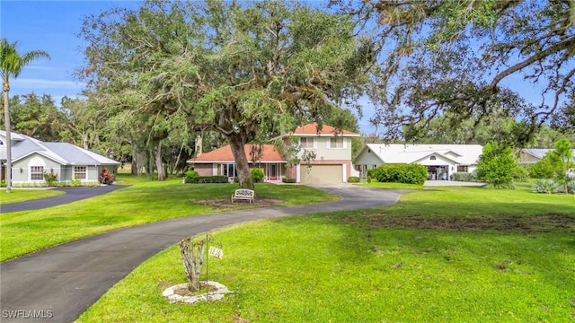 view of front facade featuring a garage and a front yard