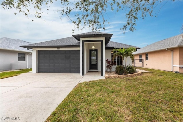 view of front facade featuring a front yard and a garage