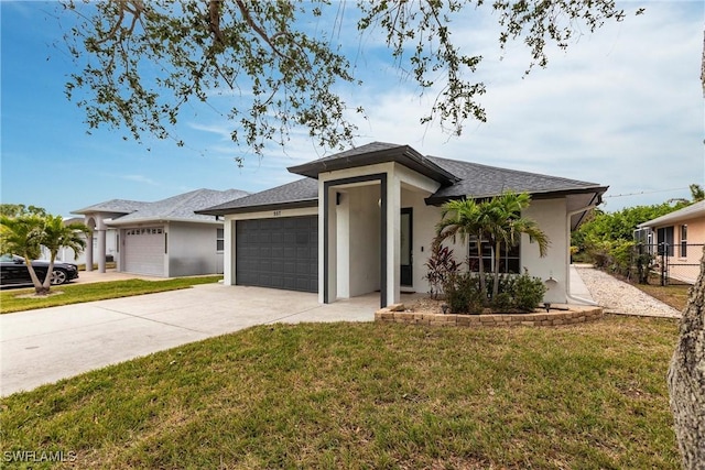 view of front of property featuring a garage and a front yard