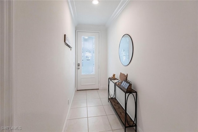 doorway with light tile patterned floors and crown molding