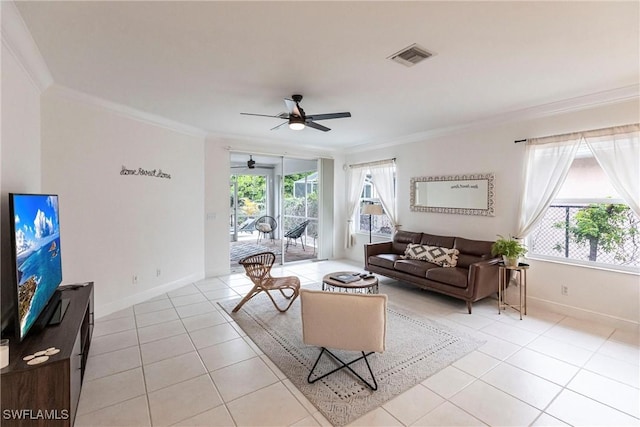 tiled living room with ceiling fan and crown molding