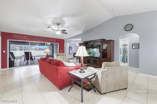 tiled living room featuring vaulted ceiling and ceiling fan