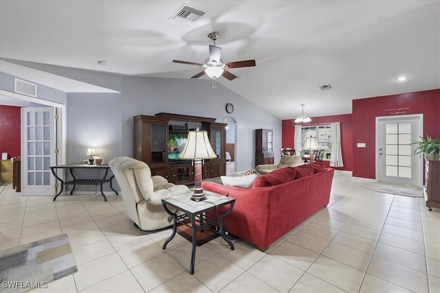 tiled living room with lofted ceiling and ceiling fan