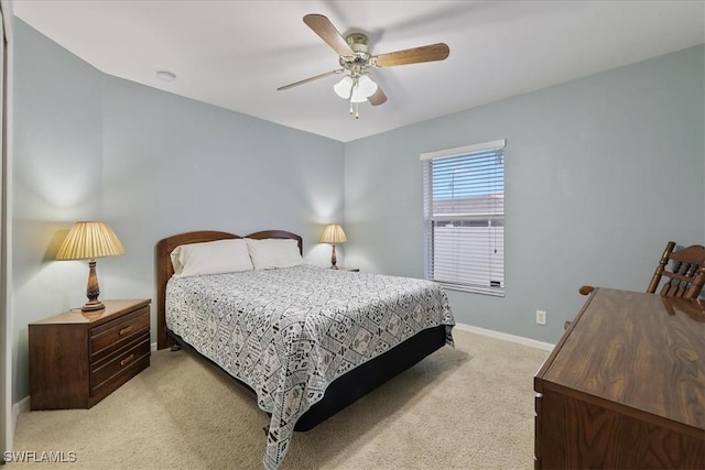 bedroom featuring ceiling fan and light carpet