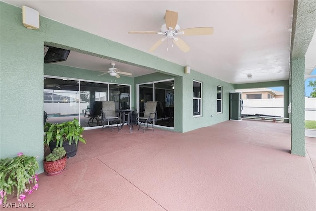 view of patio featuring ceiling fan