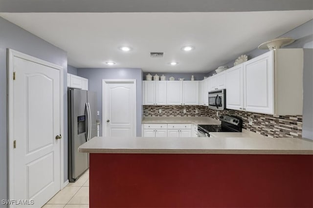 kitchen with white cabinetry, decorative backsplash, stainless steel appliances, and kitchen peninsula