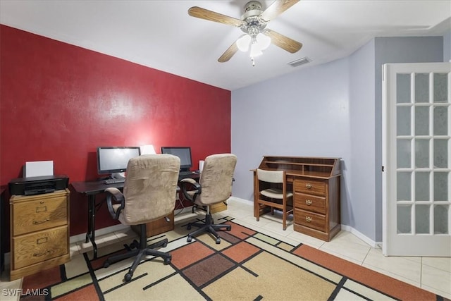 tiled home office featuring ceiling fan