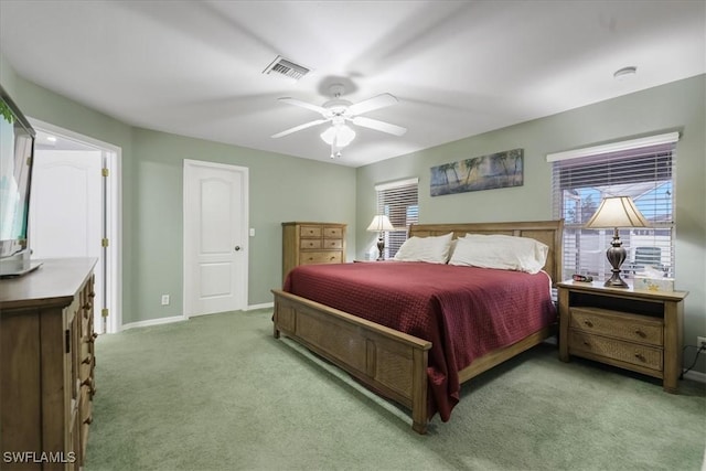 bedroom with light carpet and ceiling fan