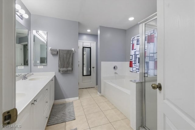 bathroom featuring tile patterned flooring, vanity, and shower with separate bathtub