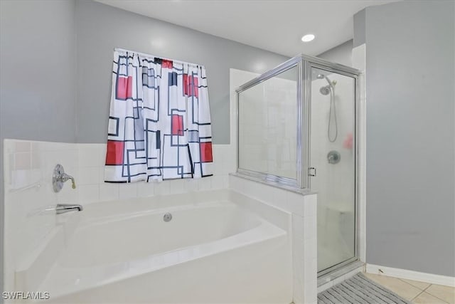 bathroom featuring plus walk in shower and tile patterned flooring