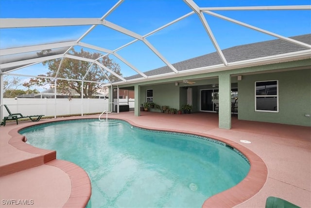 view of pool featuring a lanai and a patio