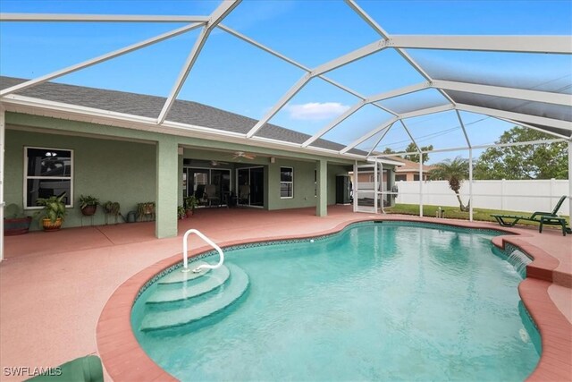 view of pool featuring a patio, a lanai, and pool water feature