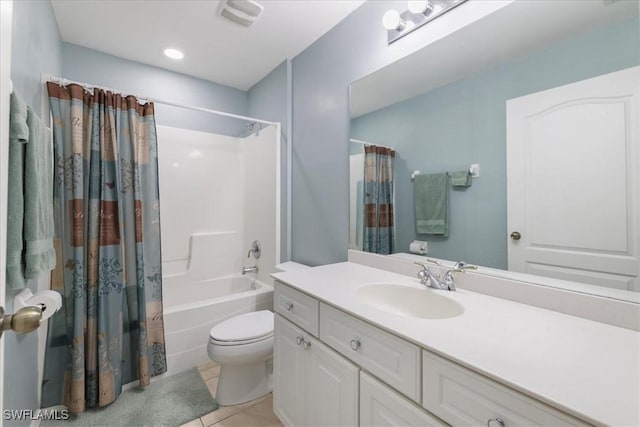 full bathroom featuring shower / tub combo, vanity, toilet, and tile patterned flooring