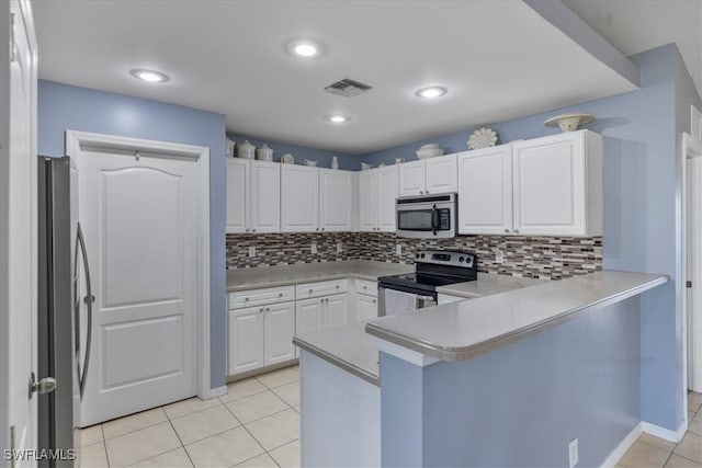 kitchen featuring white cabinetry, tasteful backsplash, light tile patterned floors, kitchen peninsula, and stainless steel appliances