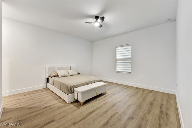 bedroom with ceiling fan and light wood-type flooring