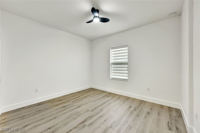 empty room featuring ceiling fan and light wood-type flooring