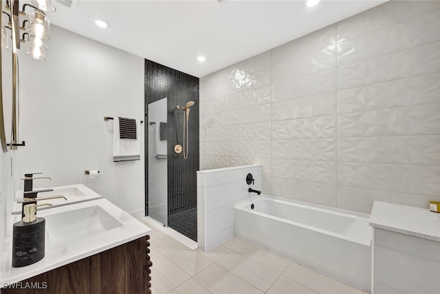 bathroom with vanity, independent shower and bath, and tile patterned flooring